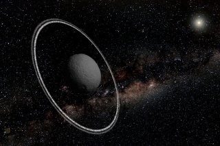 An artist's view of the rings surrounding the asteroid Chariklo, which is only 155 miles (250 kilometers) across. The asteroid is the first non-planetary body in the solar system discovered to have its own ring system. Image released March 26, 2014.