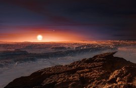 This artist's impression shows a view of the surface of the planet Proxima b orbiting the red dwarf star Proxima Centauri